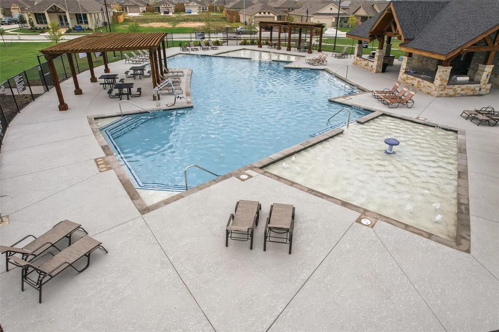 15212 Bullfighter Boulevard Haslet, TX 76052 - Photo 27 of 36 a view of swimming pool with outdoor seating