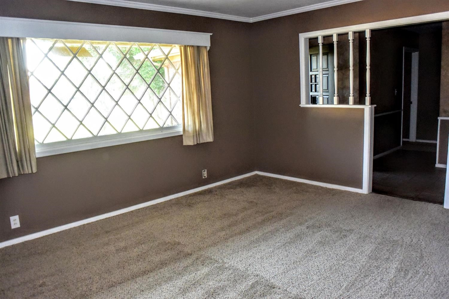 2127 52nd Street Lubbock, TX 79412 - Photo 3 of 10 a view of an empty room with a window