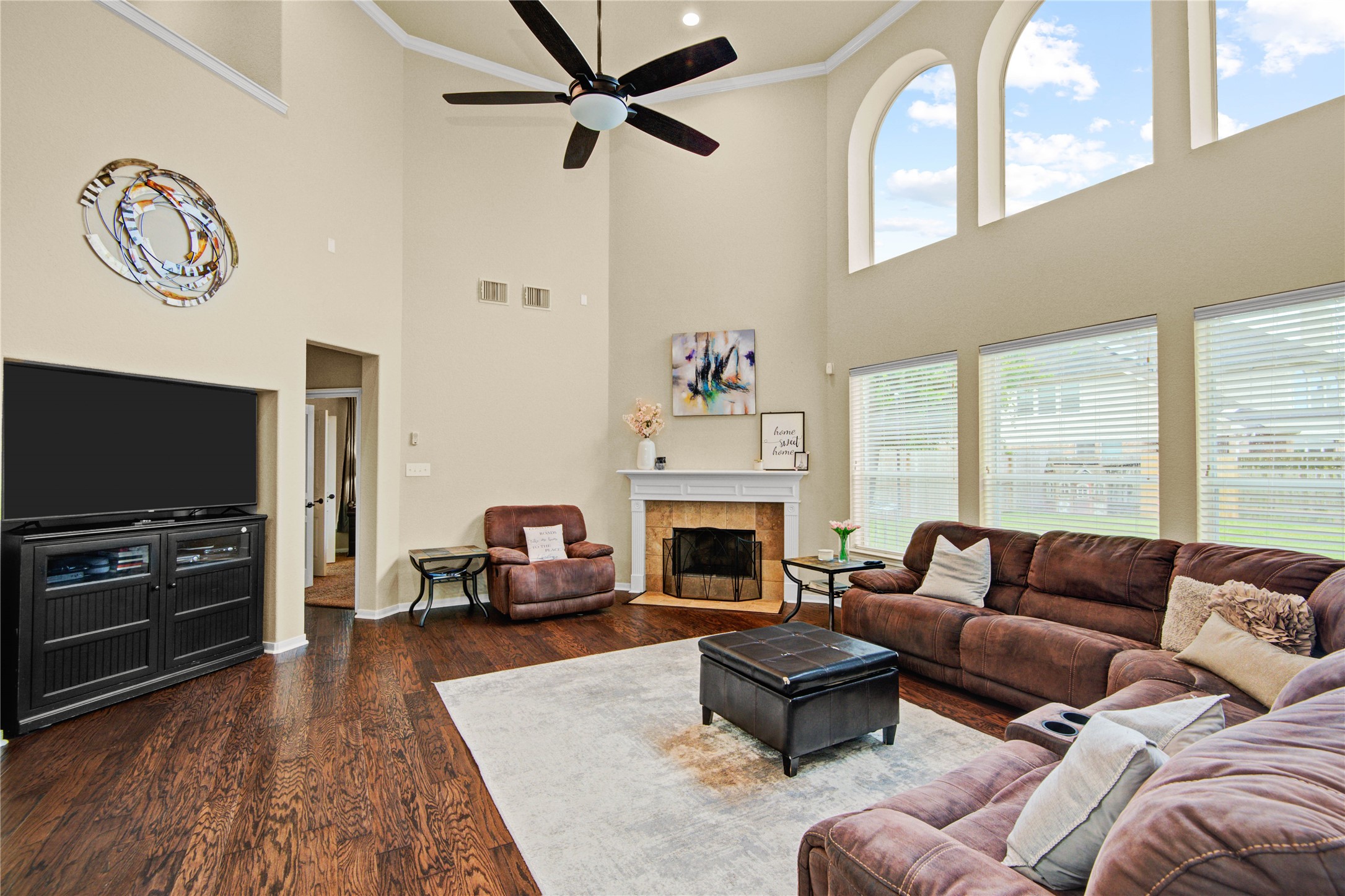 6007 Valhalla Drive Spring, TX 77379 - Photo 14 of 37 Rich flooring and expansive windows enhance the spacious feel of the open-concept family room.