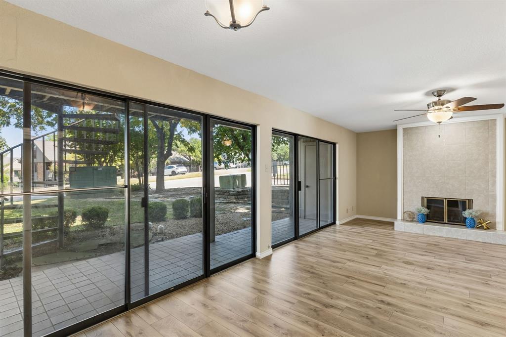 1121 Signal Ridge Place Rockwall, TX 75032 - Photo 1 of 26 A wall of sliding windows gives you abundant natural light.