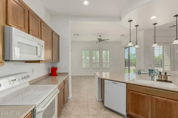 a kitchen with a sink and a wooden cabinets