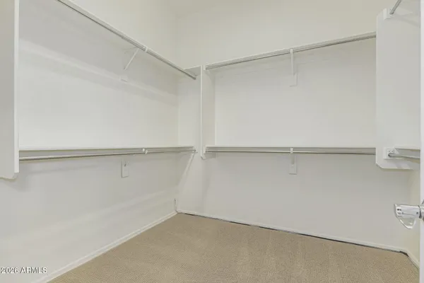 a view of an empty walk in closet