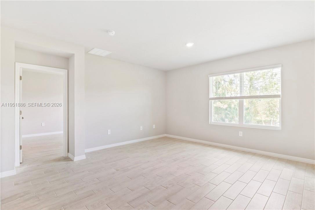 3021 North Lakewood Road LaBelle, FL 33935 - Photo 4 of 13 an empty room with windows