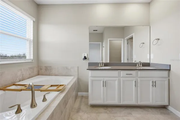 a bathroom with a tub and a shower