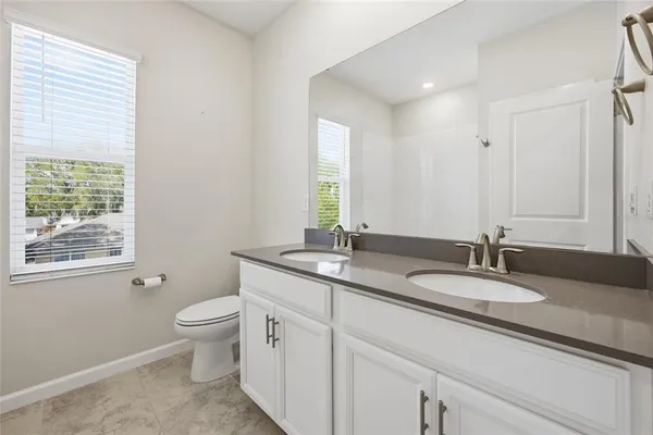a bathroom with a shower a bathtub and a shower