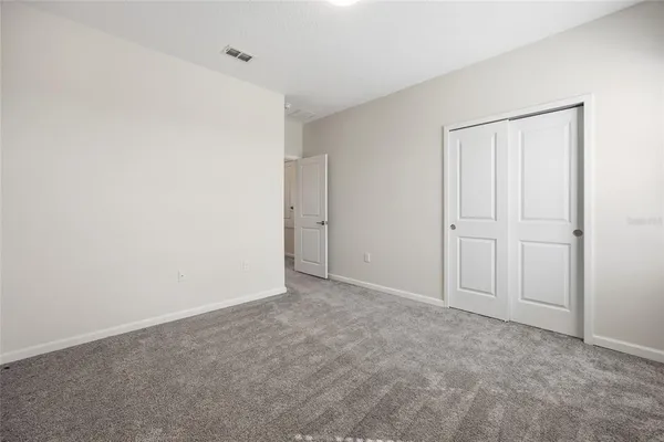 a view of balcony with floor to ceiling window