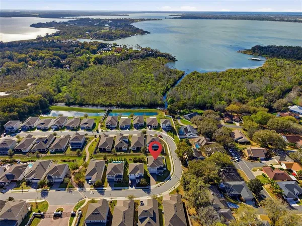 an aerial view of a house with a swimming pool