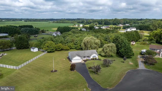 an aerial view of a golf course with parking space