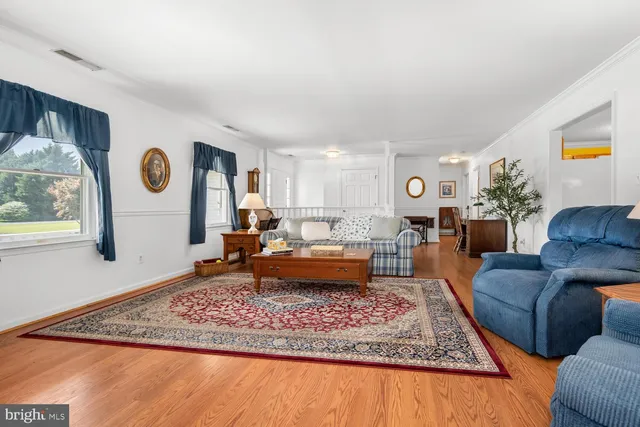 a living room with furniture and a rug