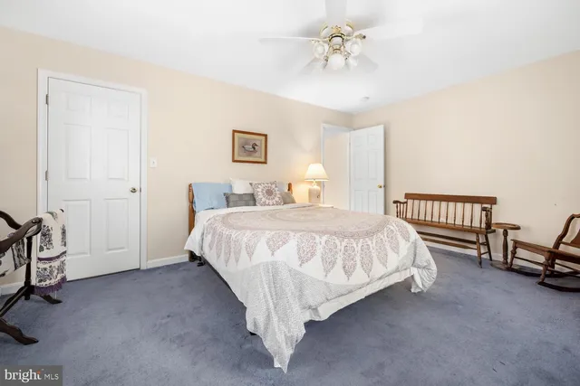 a bed room with a bed and a chandelier