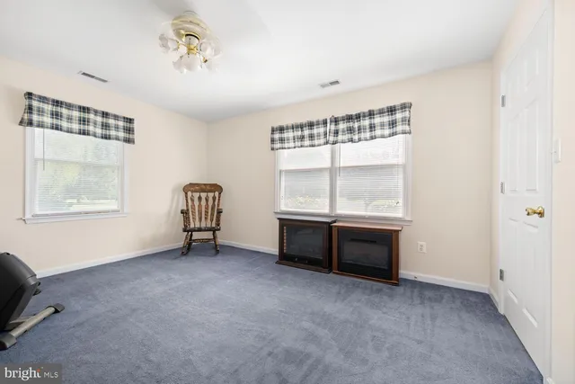 a view of workspace with furniture and window