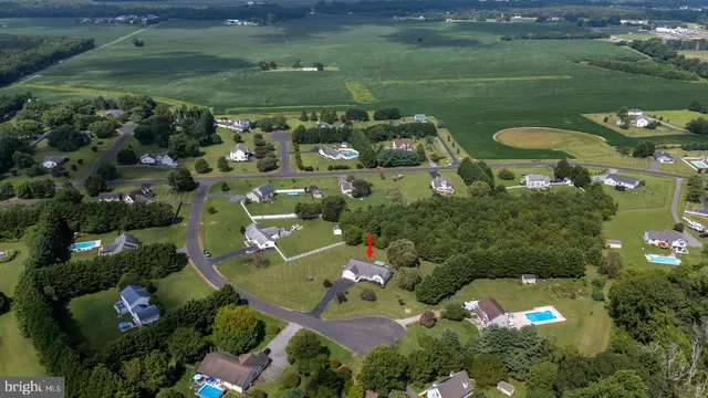 an aerial view of a house with a lake view