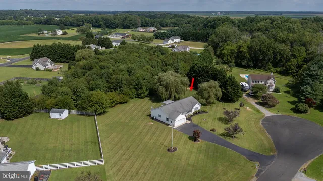 an aerial view of a house with outdoor space