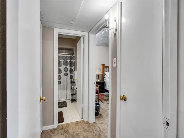 a view of a bedroom from a hallway