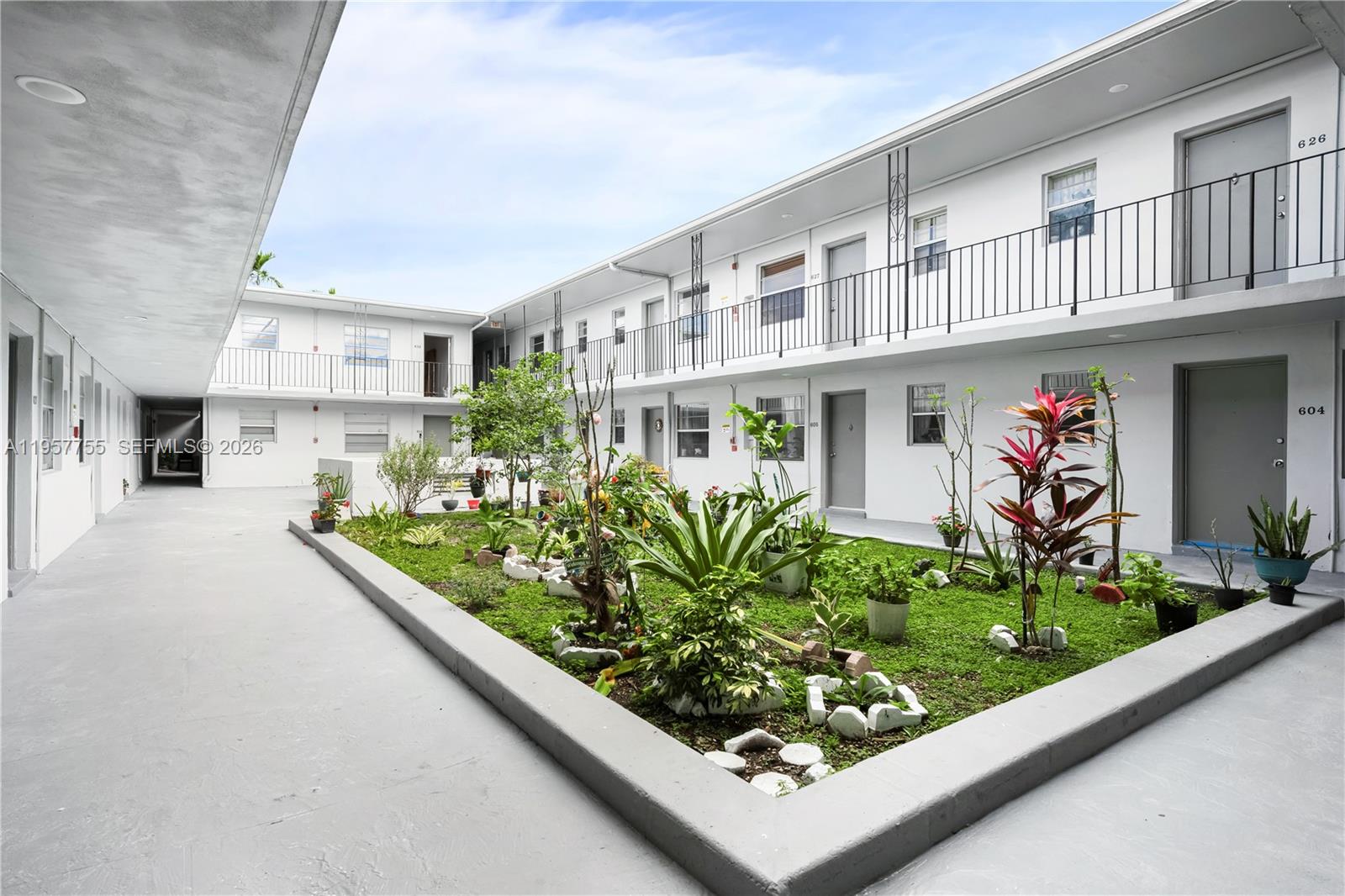 10375-35-55 Southwest 40th Street Miami, FL 33165 - Photo 2 of 13 a view of a garden with an outdoor seating