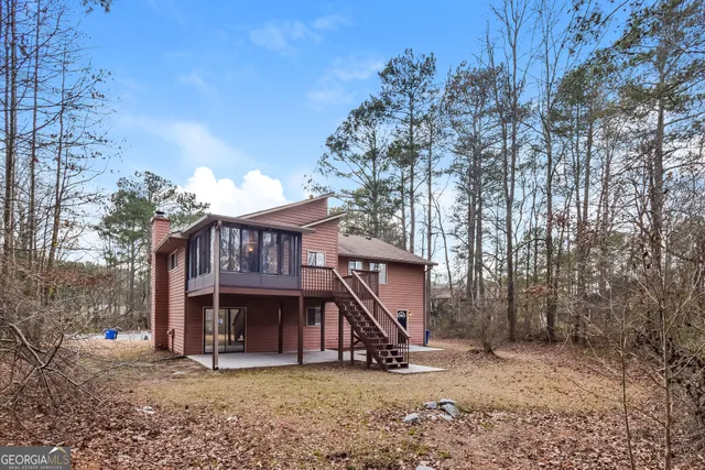 a view of a house with a yard and roof