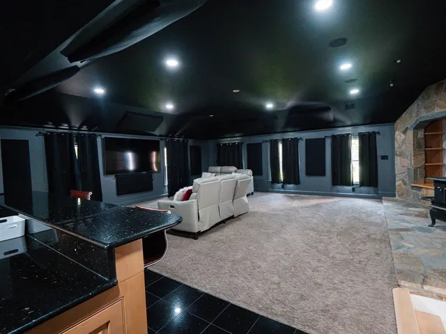 a room with furniture and flat screen tv