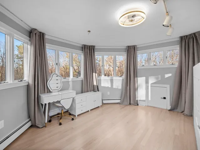 a view of a livingroom with furniture and a window