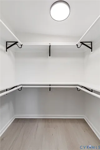 a bathroom with a toilet a sink and a mirror