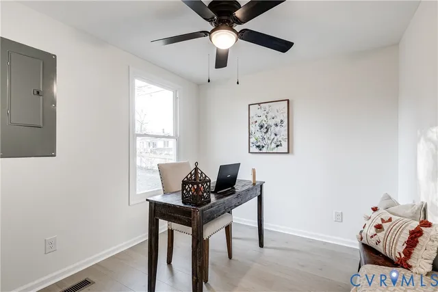 a view of a house with snow on the road