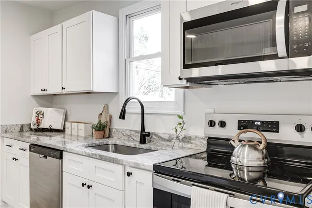 a kitchen with a stove and a microwave