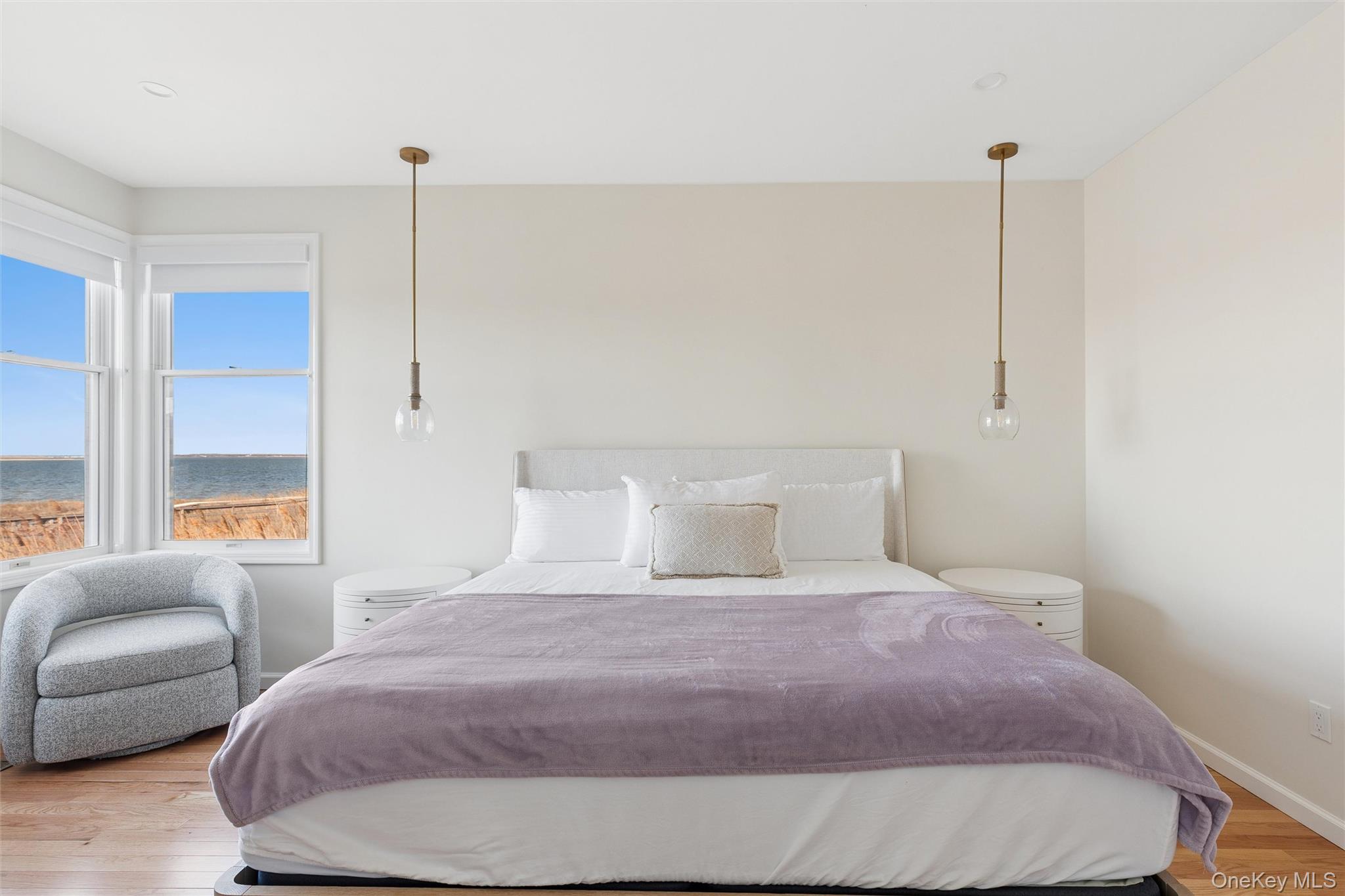 580 Dune Road, Unit 3 Westhampton Beach, NY 11978 - Photo 17 of 36 a bedroom with a bed window and couch
