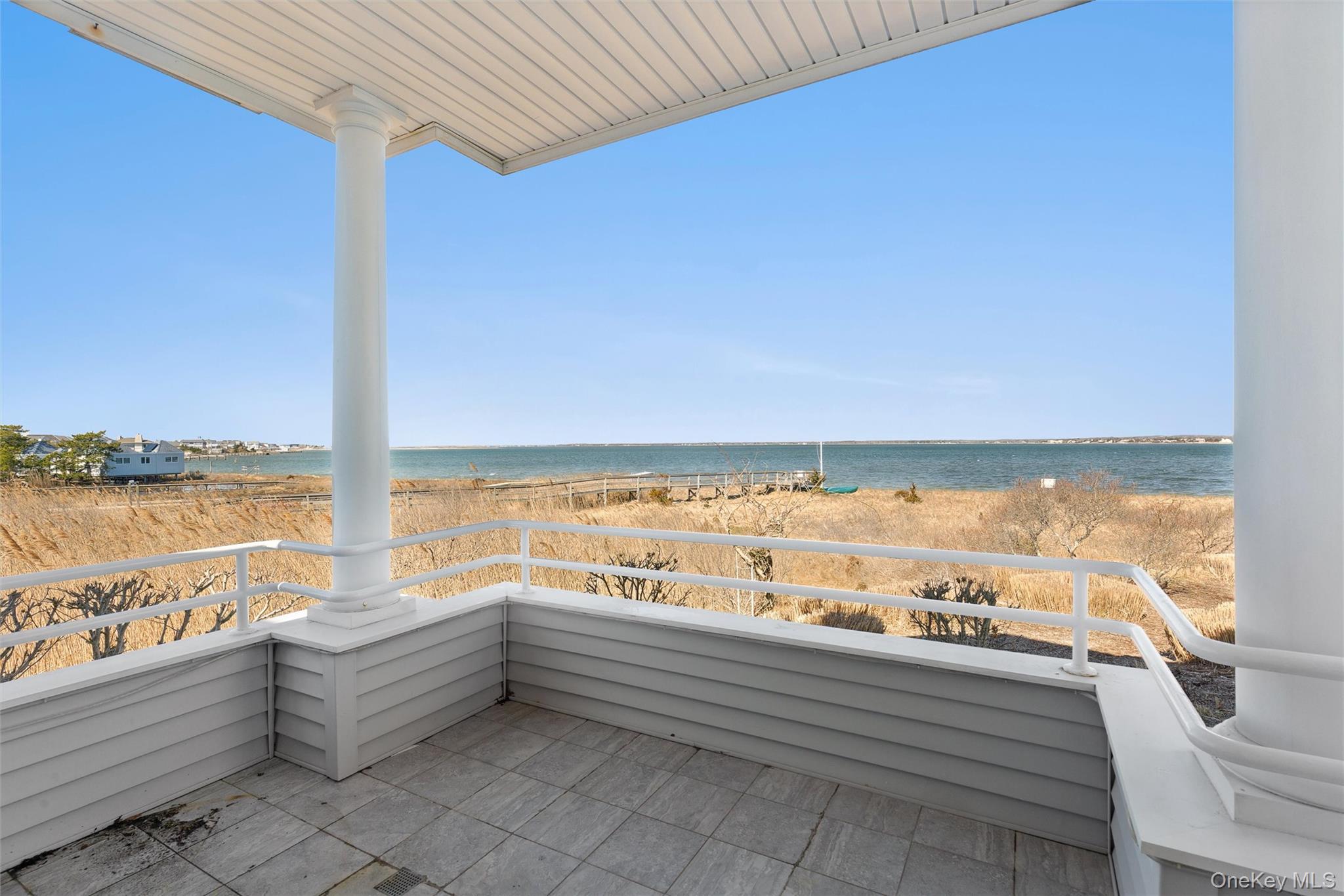 580 Dune Road, Unit 3 Westhampton Beach, NY 11978 - Photo 2 of 36 a view of an ocean and beach