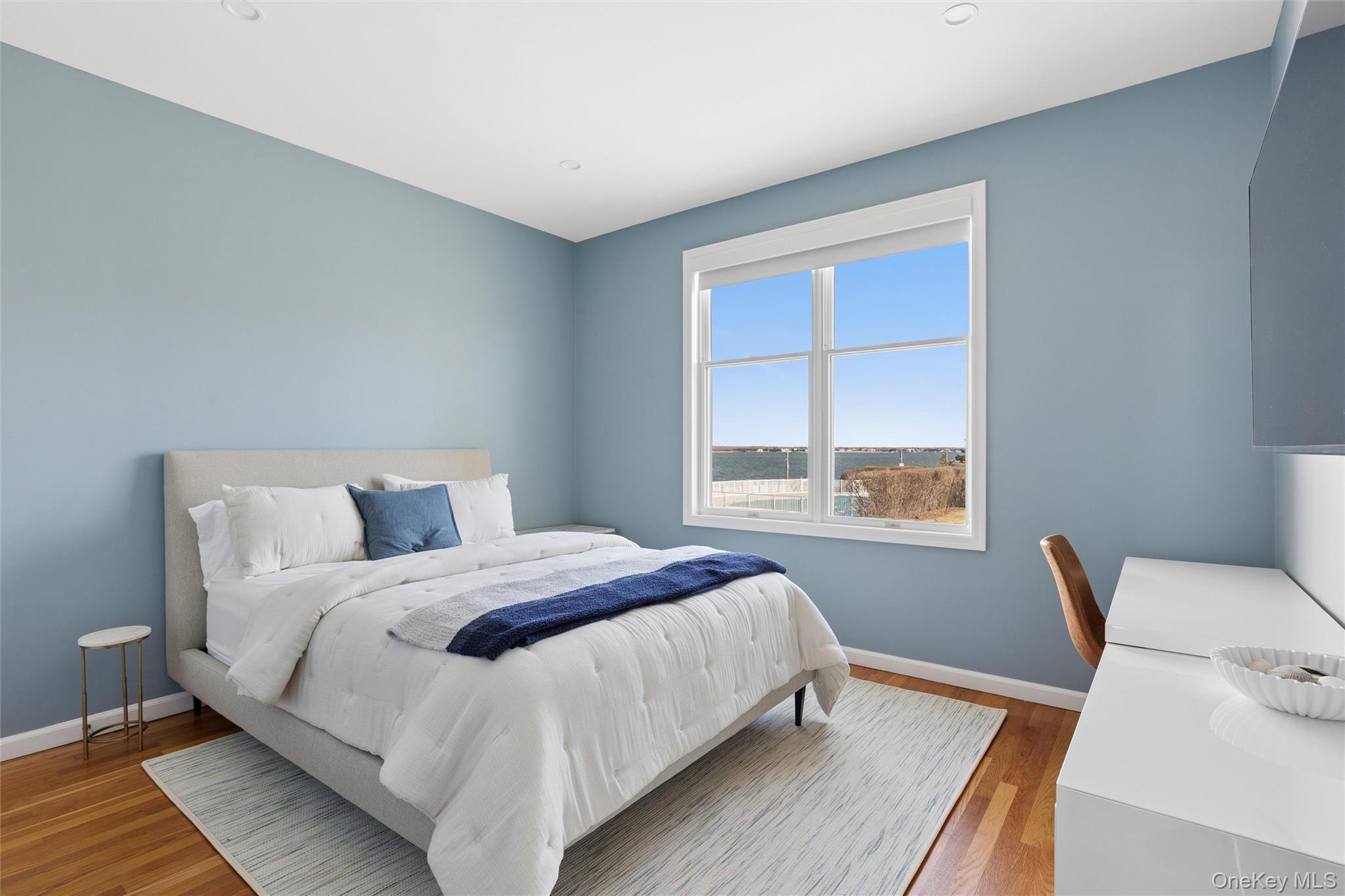 580 Dune Road, Unit 3 Westhampton Beach, NY 11978 - Photo 25 of 36 a bedroom with a bed and a window