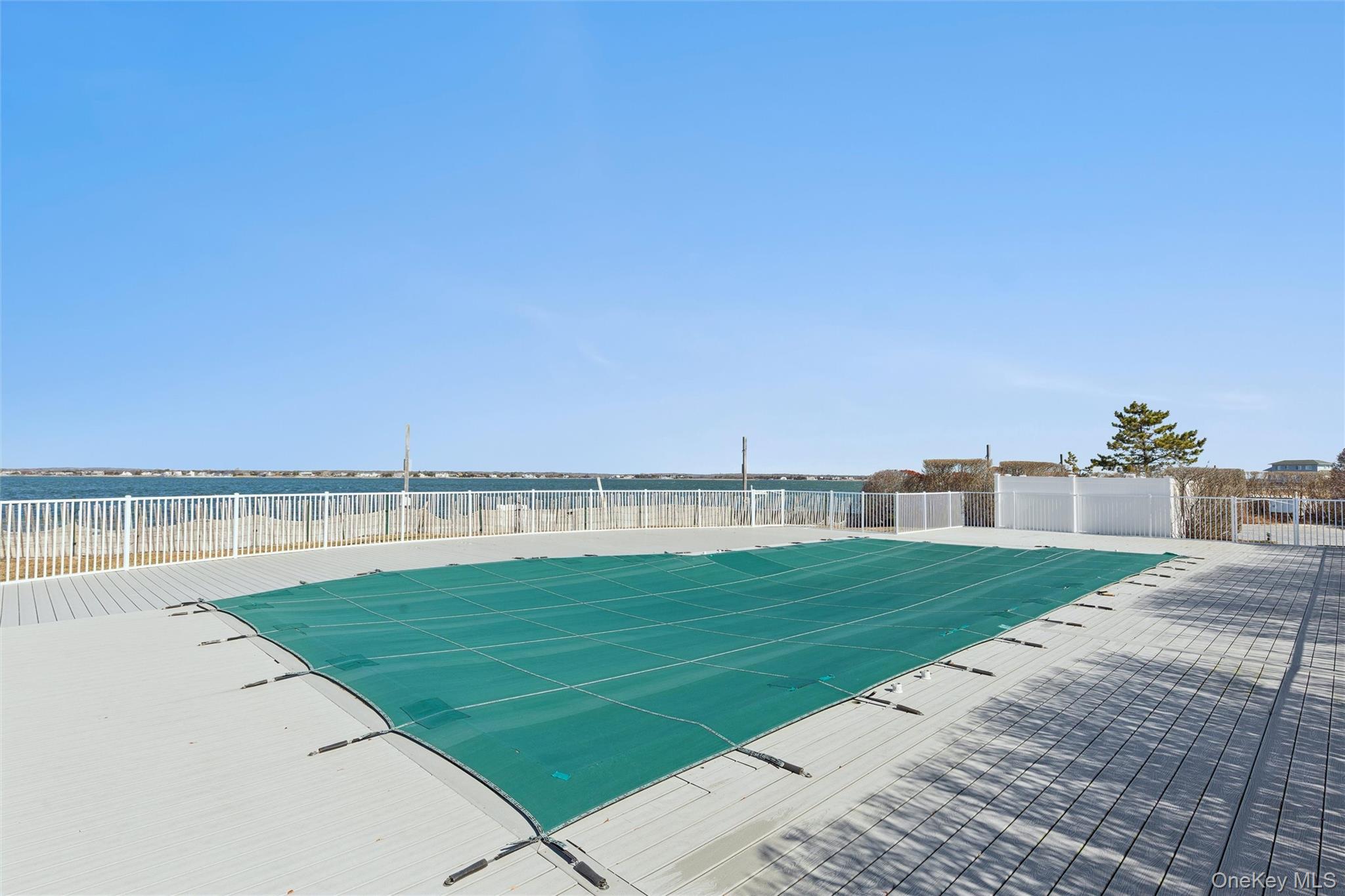 580 Dune Road, Unit 3 Westhampton Beach, NY 11978 - Photo 27 of 36 a view of a terrace with a lake view