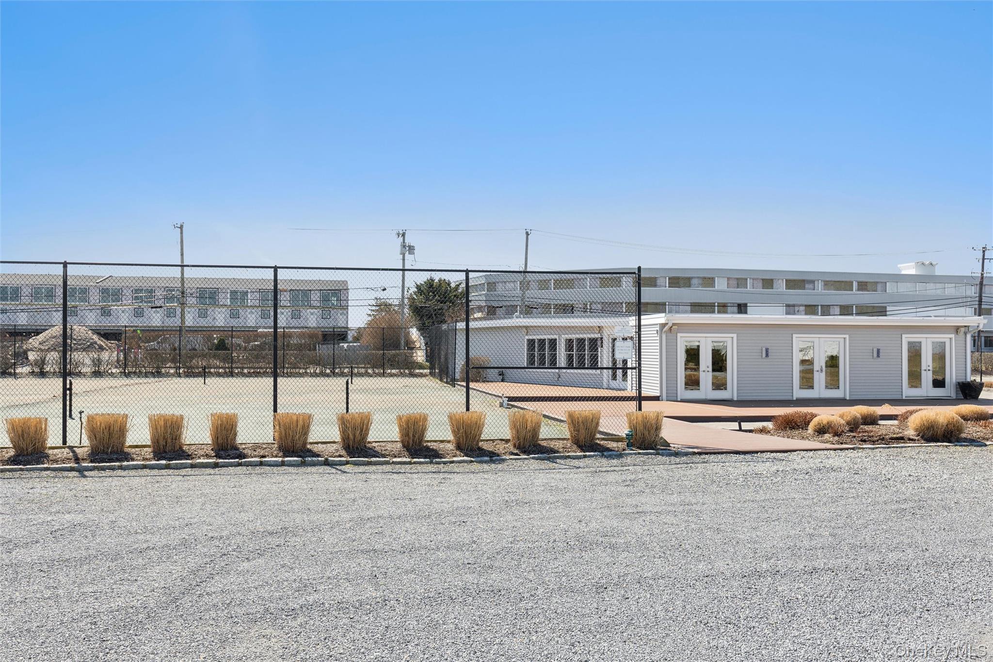 580 Dune Road, Unit 3 Westhampton Beach, NY 11978 - Photo 30 of 36 a view of a house with a big yard