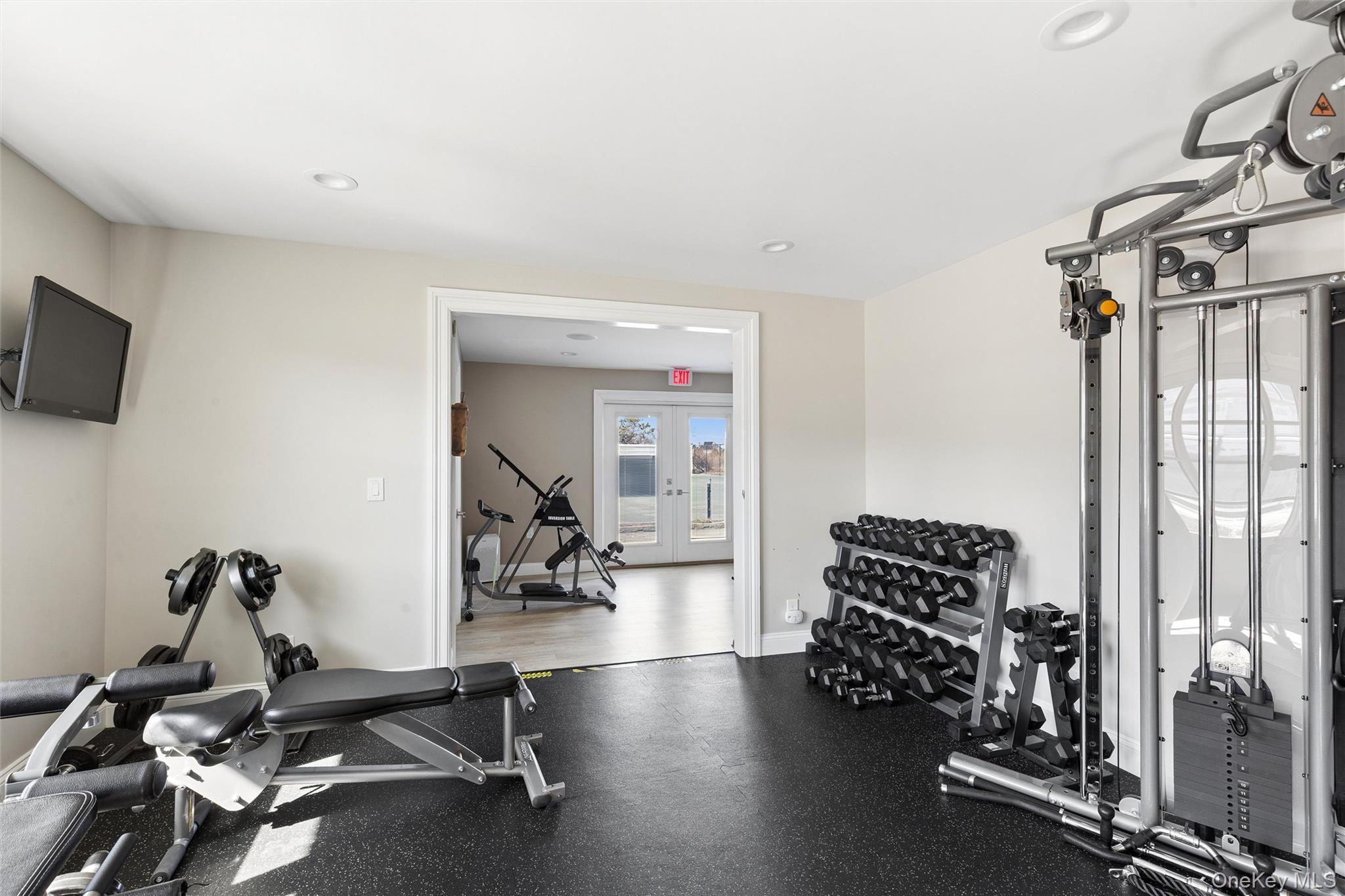580 Dune Road, Unit 3 Westhampton Beach, NY 11978 - Photo 31 of 36 a view of a room with gym equipment