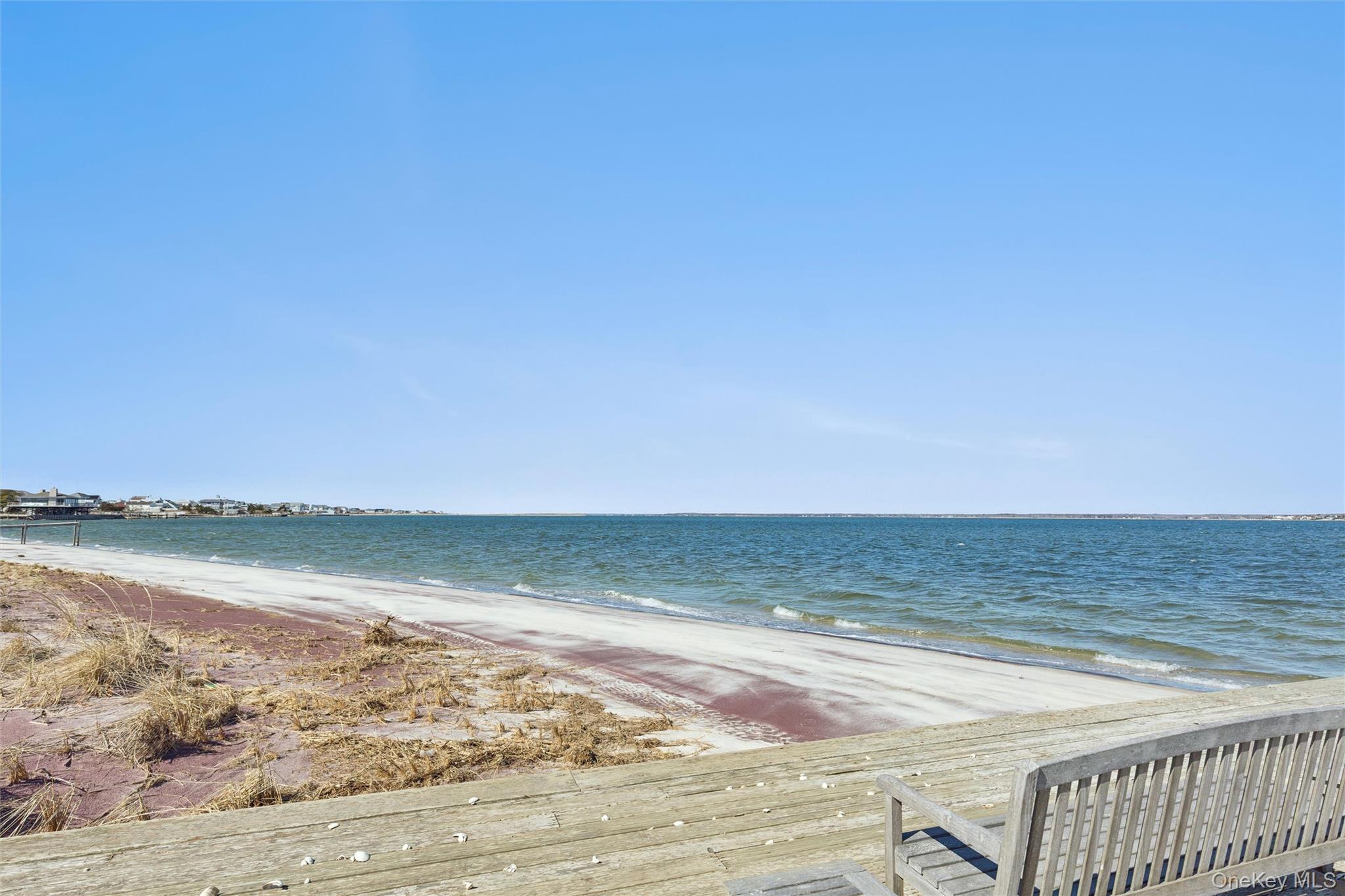 580 Dune Road, Unit 3 Westhampton Beach, NY 11978 - Photo 7 of 36 a view of an ocean and beach