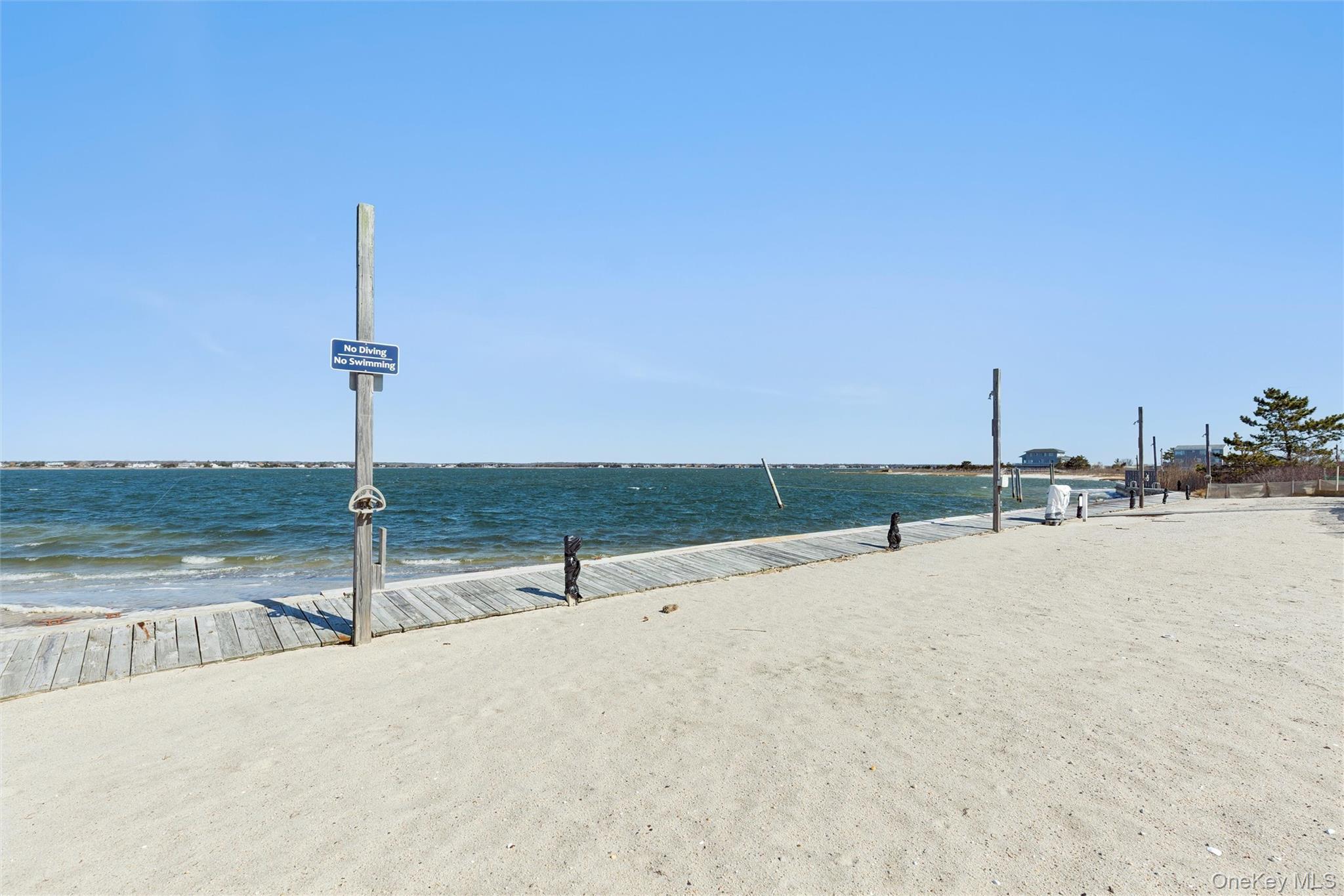 580 Dune Road, Unit 3 Westhampton Beach, NY 11978 - Photo 8 of 36 a view of a terrace with a city view