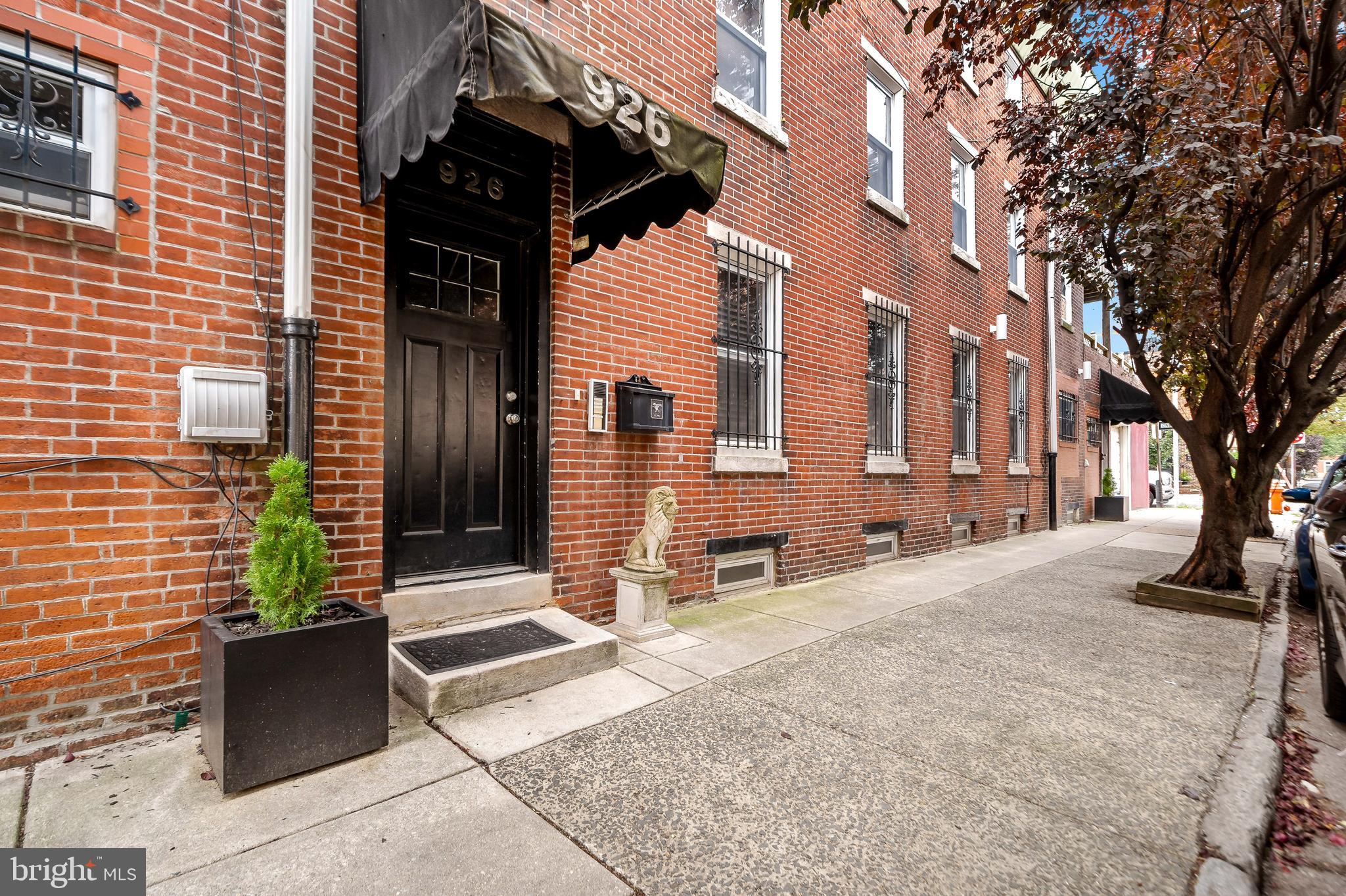 926 East Passyunk Avenue, Unit 1 Philadelphia, PA 19147 - Photo 16 of 19 a view of a house with a bench in a patio