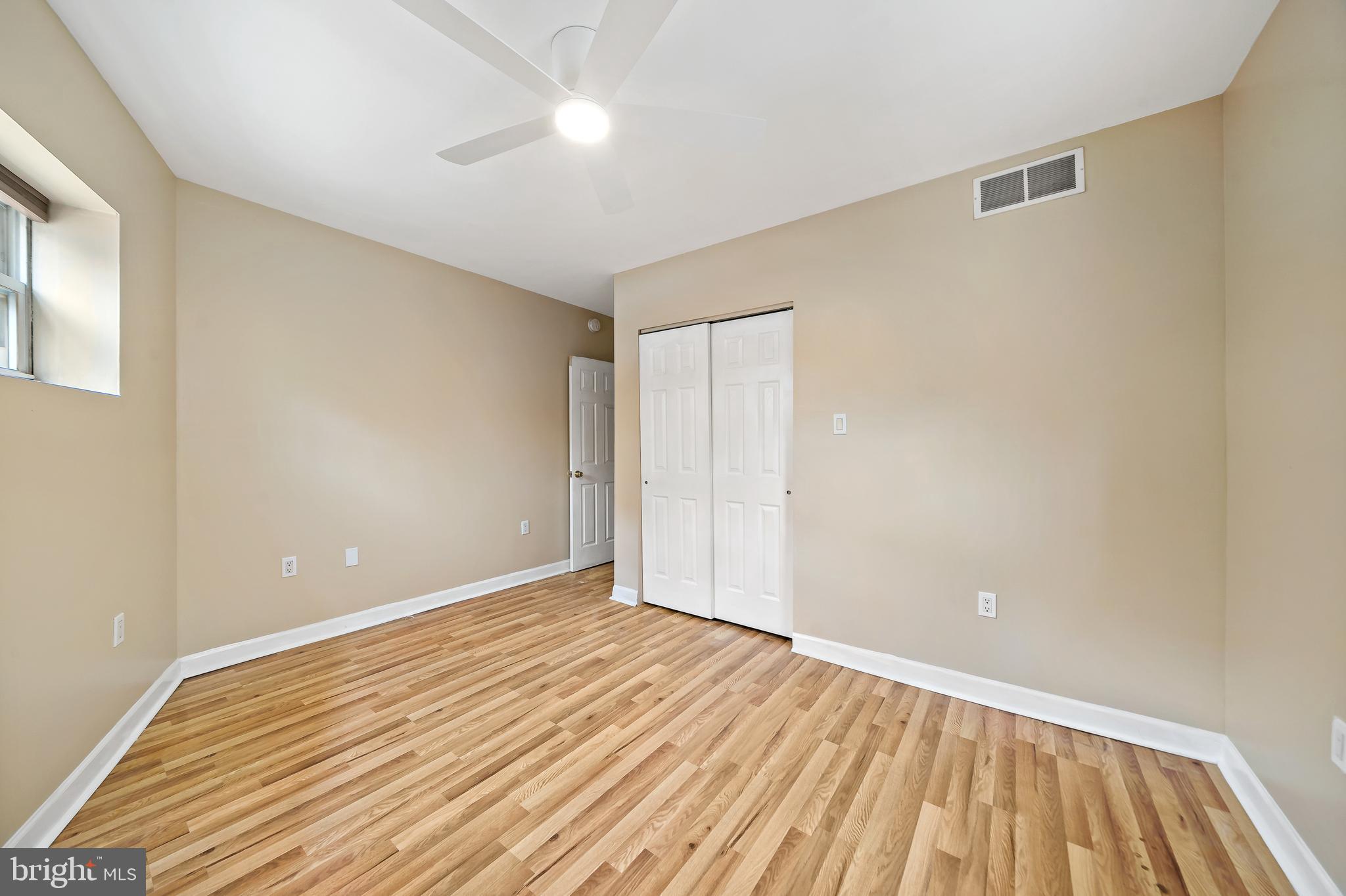926 East Passyunk Avenue, Unit 1 Philadelphia, PA 19147 - Photo 6 of 19 a view of an empty room with wooden floor
