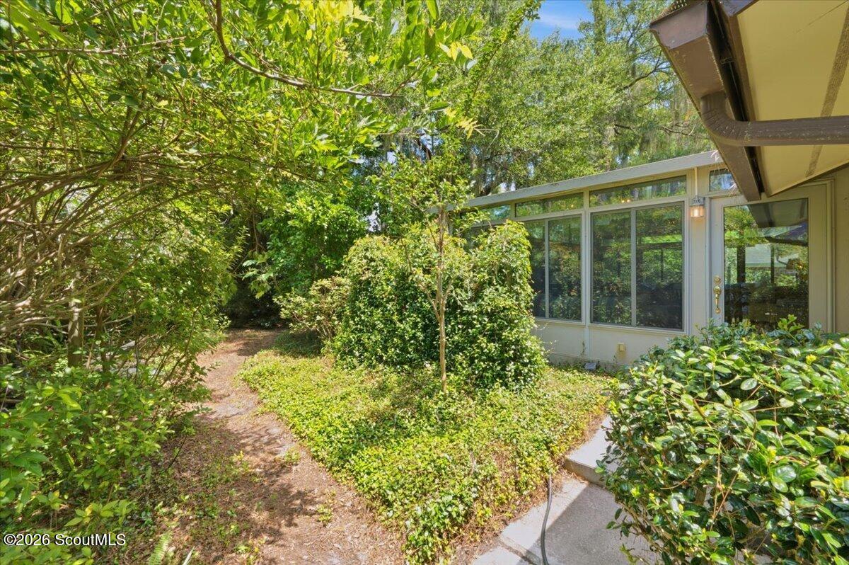 554 Old Plantation Road Jekyll Island, GA 31527 - Photo 46 of 58 Sunroom in the backyard