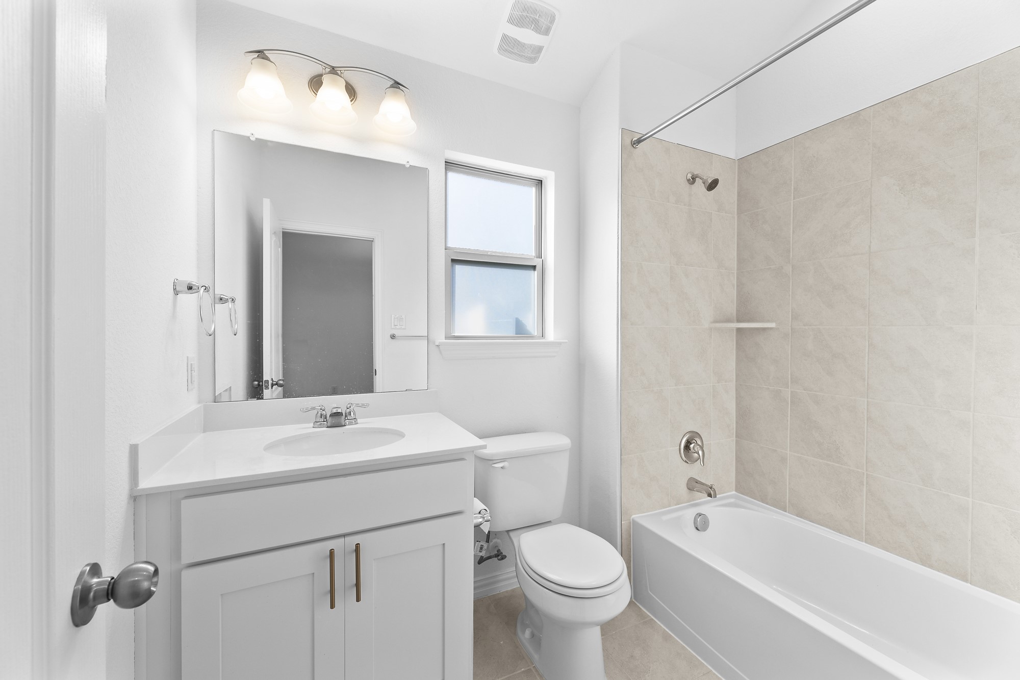 489 Cherrystone Loop Buda, TX 78610 - Photo 16 of 21 a bathroom with a sink toilet a shower and a mirror