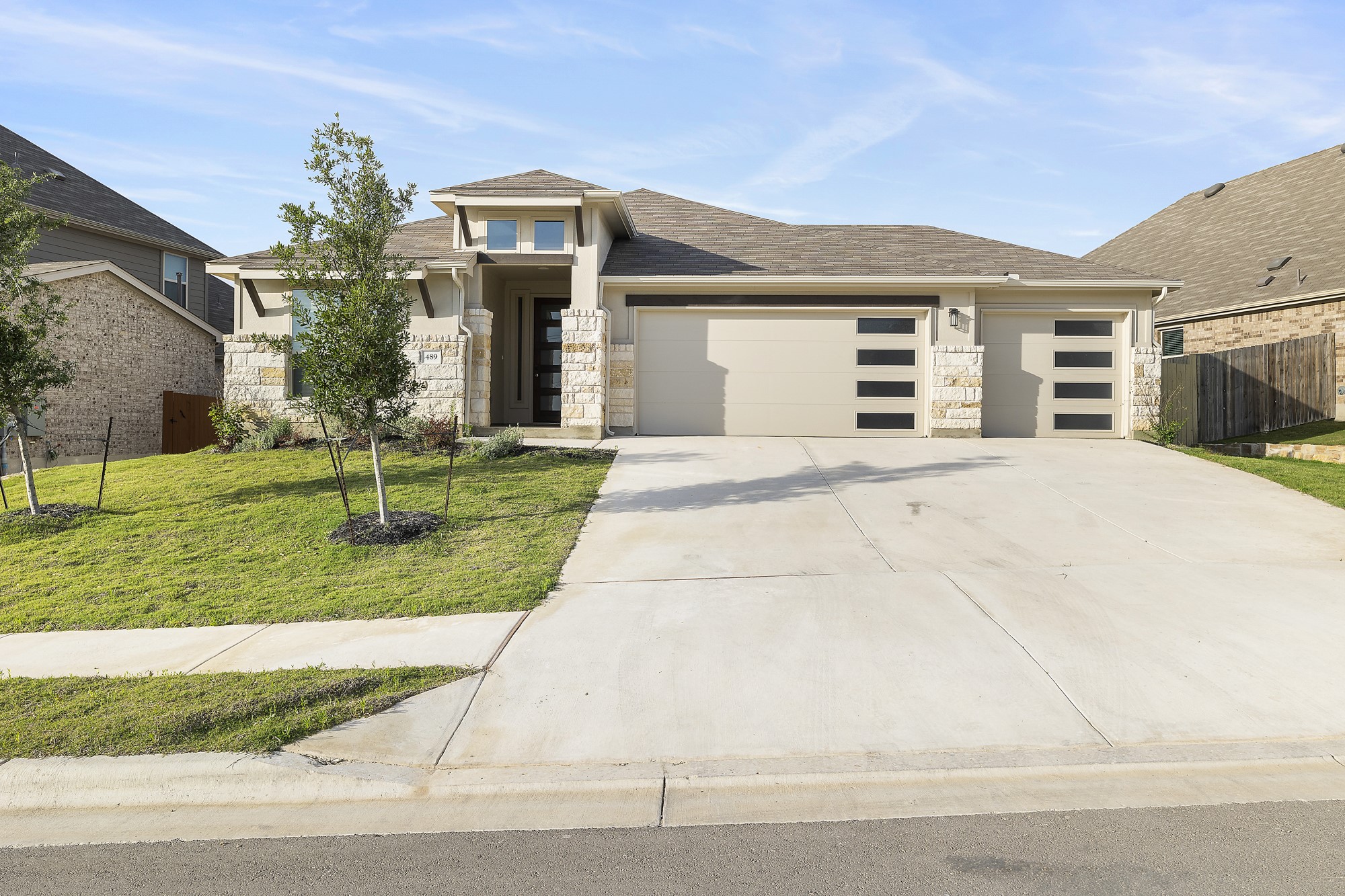 489 Cherrystone Loop Buda, TX 78610 - Photo 18 of 21 a front view of house with yard