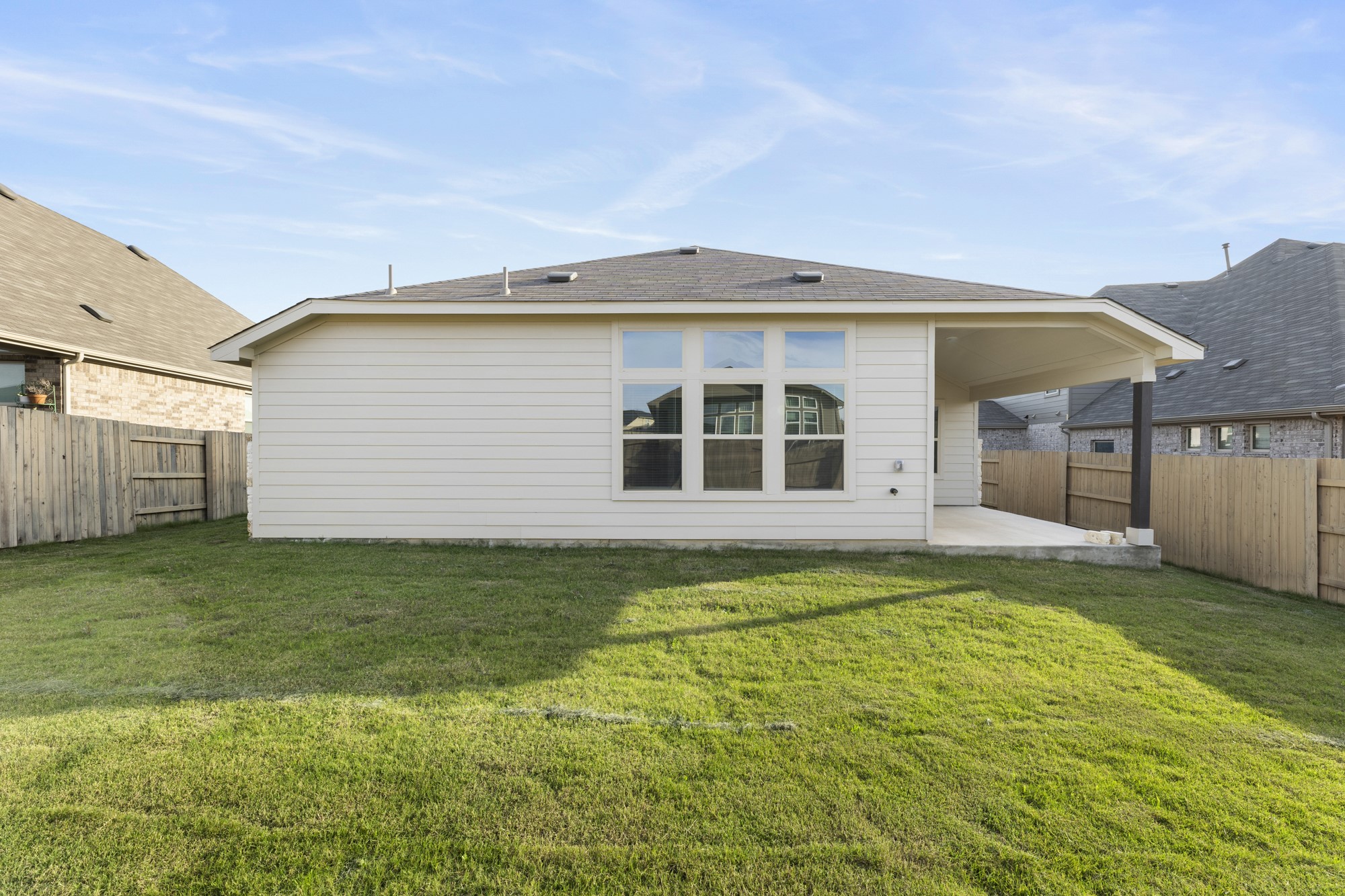 489 Cherrystone Loop Buda, TX 78610 - Photo 19 of 21 a view of a house with a yard