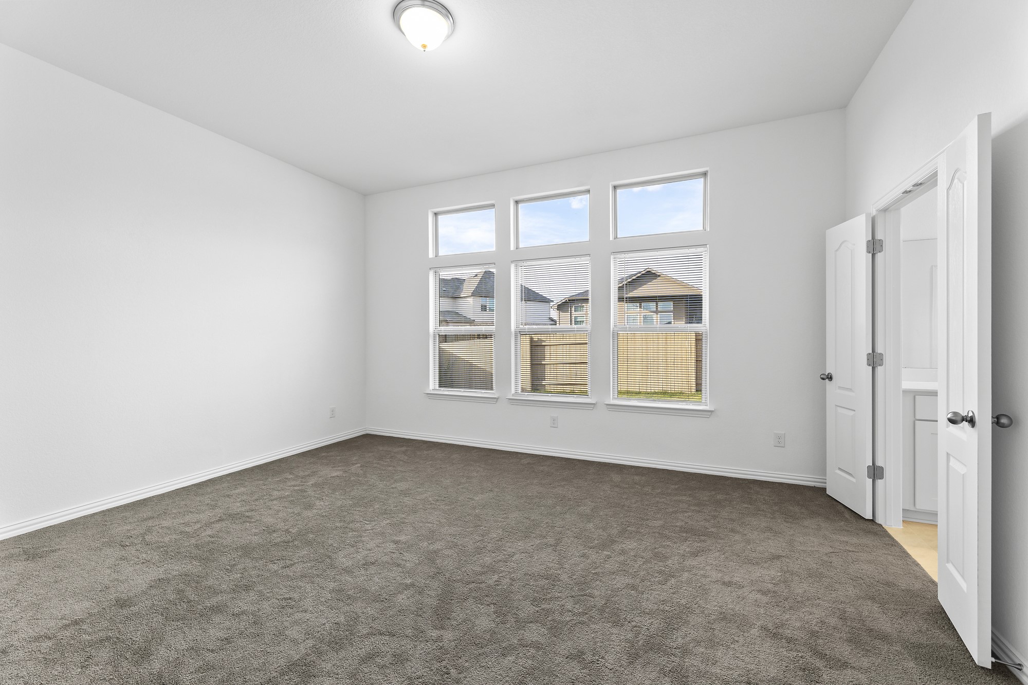 489 Cherrystone Loop Buda, TX 78610 - Photo 8 of 21 an empty room with windows