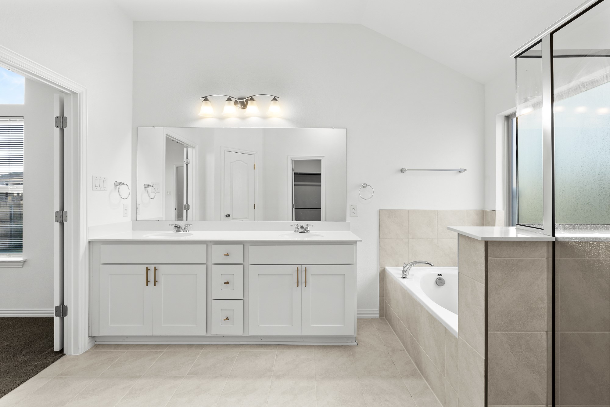 489 Cherrystone Loop Buda, TX 78610 - Photo 9 of 21 a bathroom with a double vanity sink mirror and double
