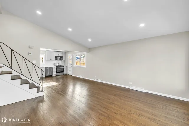 a view of livingroom with hardwood floor and workspace