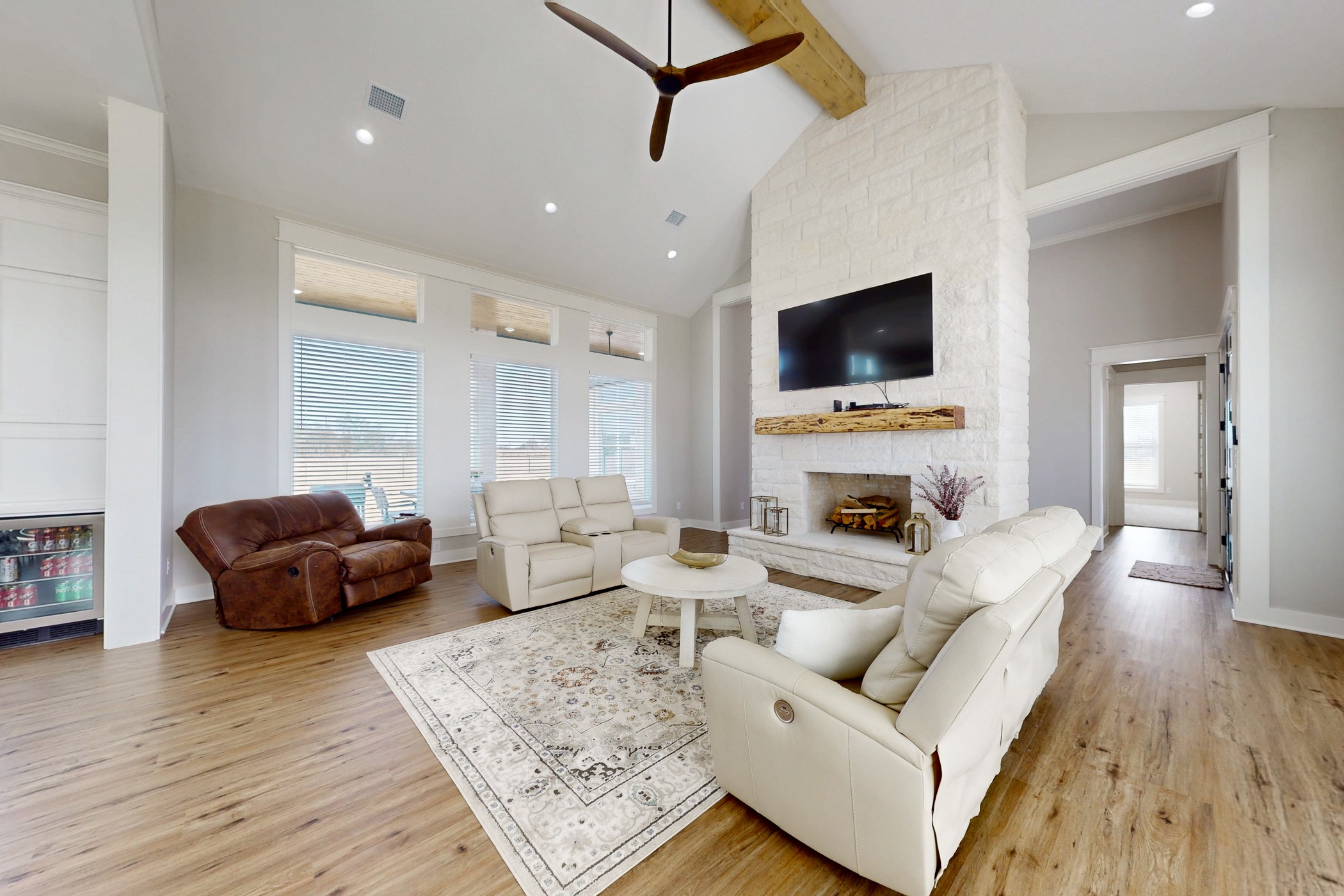 13504 Hudson Farms Road Franklin, TX 77856 - Photo 34 of 49 a living room with furniture a flat screen tv and a fireplace