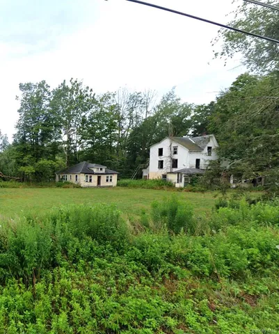 a house view with a garden space