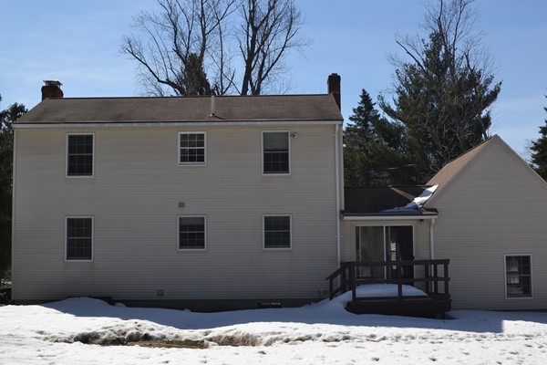 110 Boston Post Road Wayland, MA 01778 - Photo 19 of 20 a front view of a house with a yard