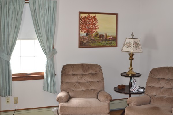 110 Boston Post Road Wayland, MA 01778 - Photo 7 of 20 a view of a livingroom with furniture and a window