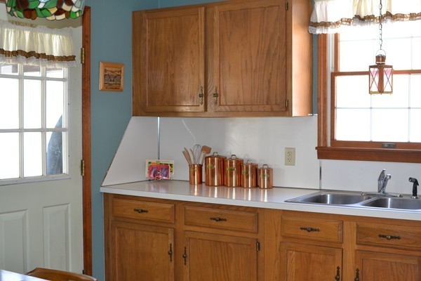 110 Boston Post Road Wayland, MA 01778 - Photo 9 of 20 a kitchen with stainless steel appliances granite countertop a sink and cabinets