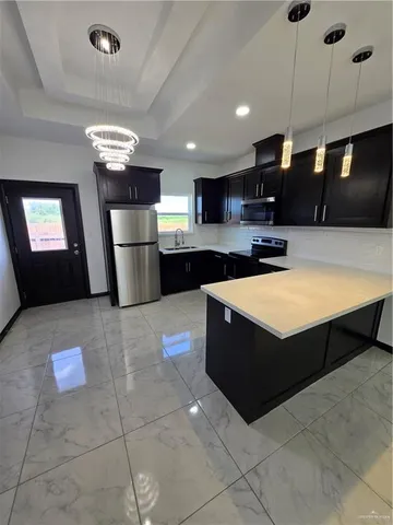 a lobby with furniture and a flat screen tv