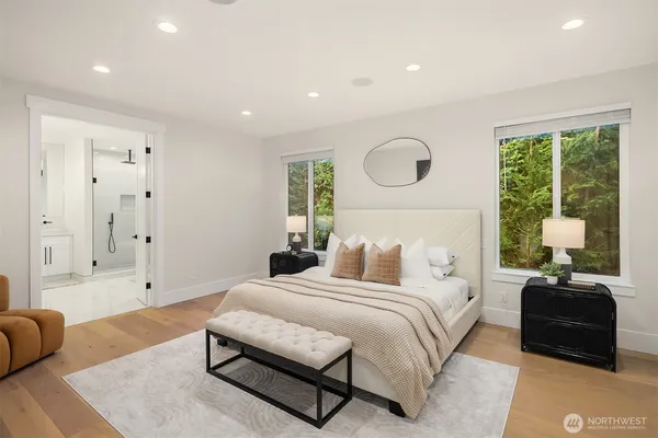 a bedroom with bed and a couch