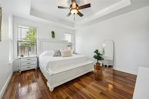 a bed room with a bed and a chandelier